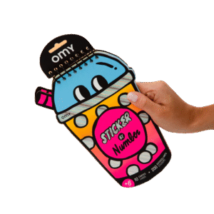 A hand holds the Bubble Tea - Sticker by Number & Postcards, a spiral-bound sticker book shaped like a cute cartoon drinks cup with eyes and pink straw—great for ages 6+ and packed with creative sticker fun. Gate21.ee