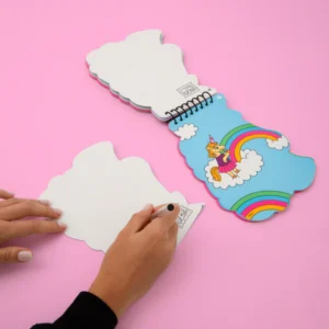 A person uses the Lily - Sticker Activity Book & Postcards, curated for Tallinn shopping. This spiral-bound book features fun activities and postcards&mdash;perfect for any concept shop collection. Gate21.ee