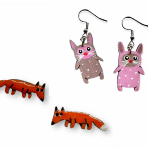 ETSKAE earrings - K&Otilde;IK: One pair features pink rabbits with white spots, the other orange foxes with white tails. Displayed on a white background, they're perfect for Tallinn shopping and showcase curated Estonian design. Gate21.ee