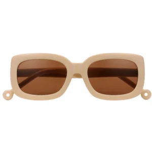 The "Duna" Creamy Sunglasses feature thick beige rectangular frames, brown tinted lenses, and small circular accents at each lower corner—ideal for anyone seeking a uniquely stylish eyewear choice. Gate21.ee