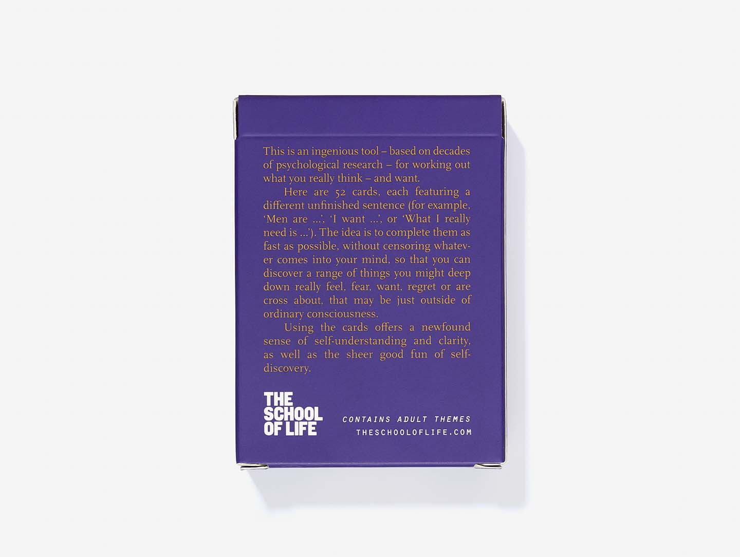 A purple box with white text contains the "Complete the Sentence Game" by The School of Life, inspired by Estonian design—a curated card deck prompting self-reflection and discovery with unfinished sentences, ideal for any gift shop. Gate21.ee