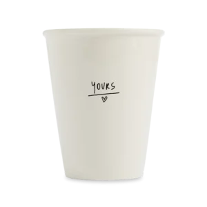 The Yours cup features the handwritten word "yours" in black above a small heart on plain white ceramic—a curated piece of Estonian design ideal for modern concept shops. Gate21.ee