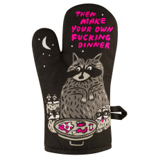 A black “Make your own dinner - Oven Glove” by BlueQ featuring a cartoon raccoon holding a pan of food, flanked by two smaller raccoons, with the text “THEN MAKE YOUR OWN FUCKING DINNER” in bold pink uppercase letters. Gate21.ee