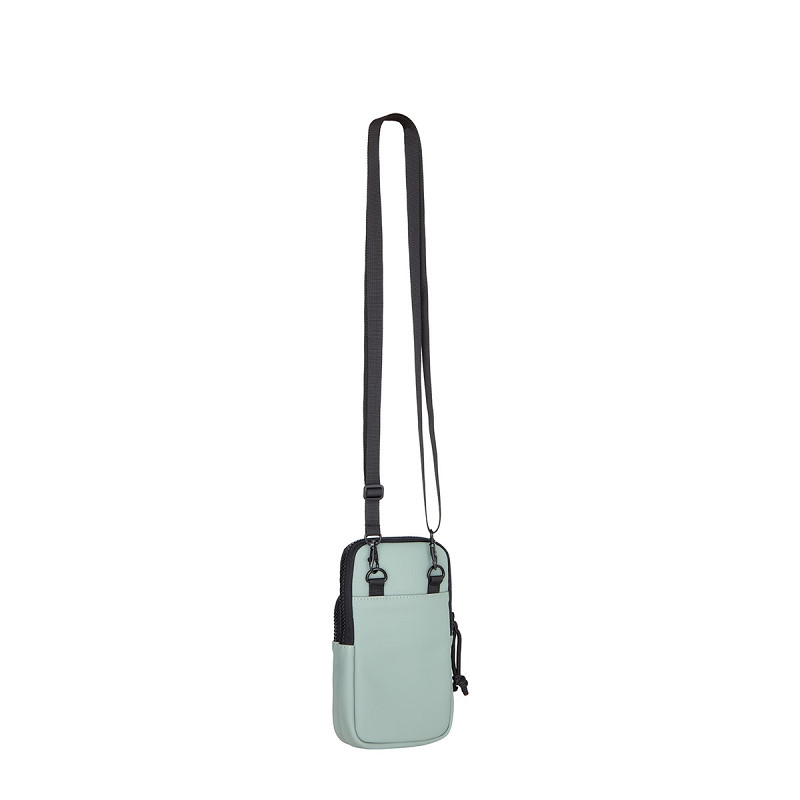 A compact, sage green crossbody bag named Astoria - Phone Pocket with a long adjustable black strap, front pocket, and zip fastening—an Estonian design perfect for unique style ideas. Displayed against a plain white background. Gate21.ee