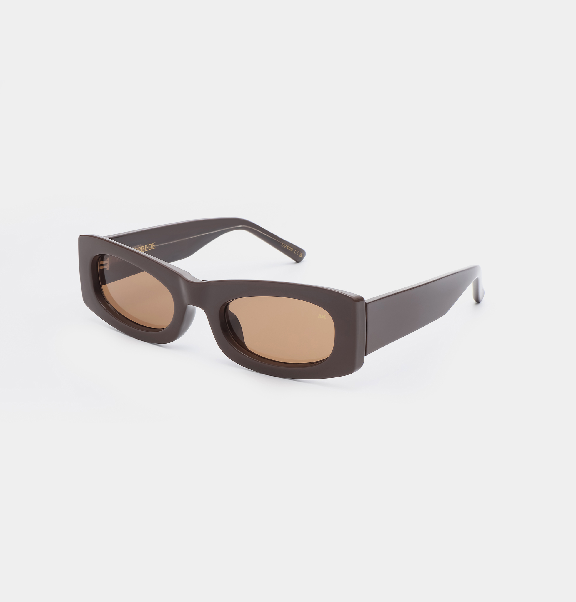 FRIDA - Chocolate: Rectangular, thick-framed brown sunglasses with lightly tinted lenses, showcased on a white background—ideal for anyone looking for curated accessories and unique finds from Tallinn shopping. Gate21.ee