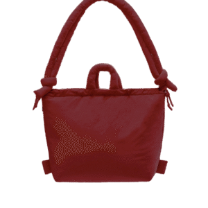 The Ona Soft Bag - Cherry Red is a padded tote with two handles—one large with knotted ends and one smaller—shown on a plain white background, offering a stylish touch for unique ideas and gift shop collections. Gate21.ee