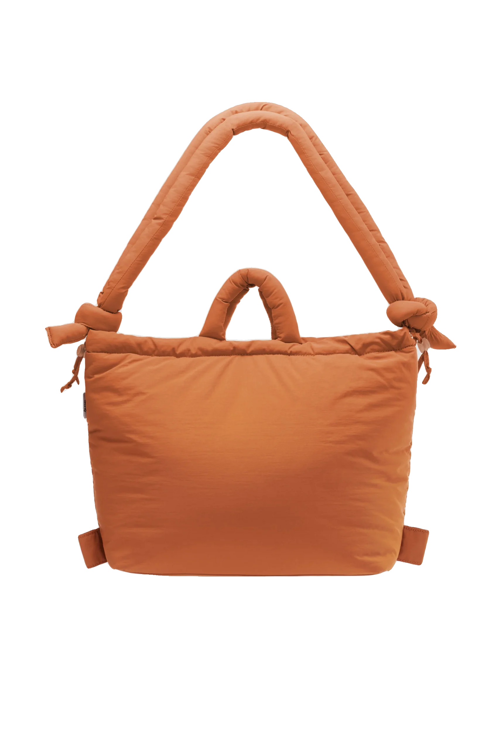 The Ona Soft Bag - Oxide is a large, rectangular, padded orange tote with two handles—one short and one long, each knotted at the ends—shown against a plain white background for a curated concept shop look. Gate21.ee