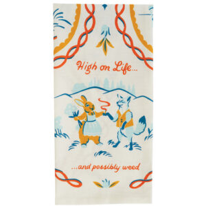 The "High on Life - Tea Towel" features a cartoon rabbit and fox holding hands, the fox with a pipe. This playful Estonian design displays "High on Life... and possibly weed" in orange, blue, and yellow. Gate21.ee