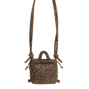 The Micro Ona Soft Bag - Leopard features a brown base with black leopard print, two knotted shoulder straps, a top handle, and a zip fastening—an eye-catching piece of Estonian design on a plain white background. Gate21.ee