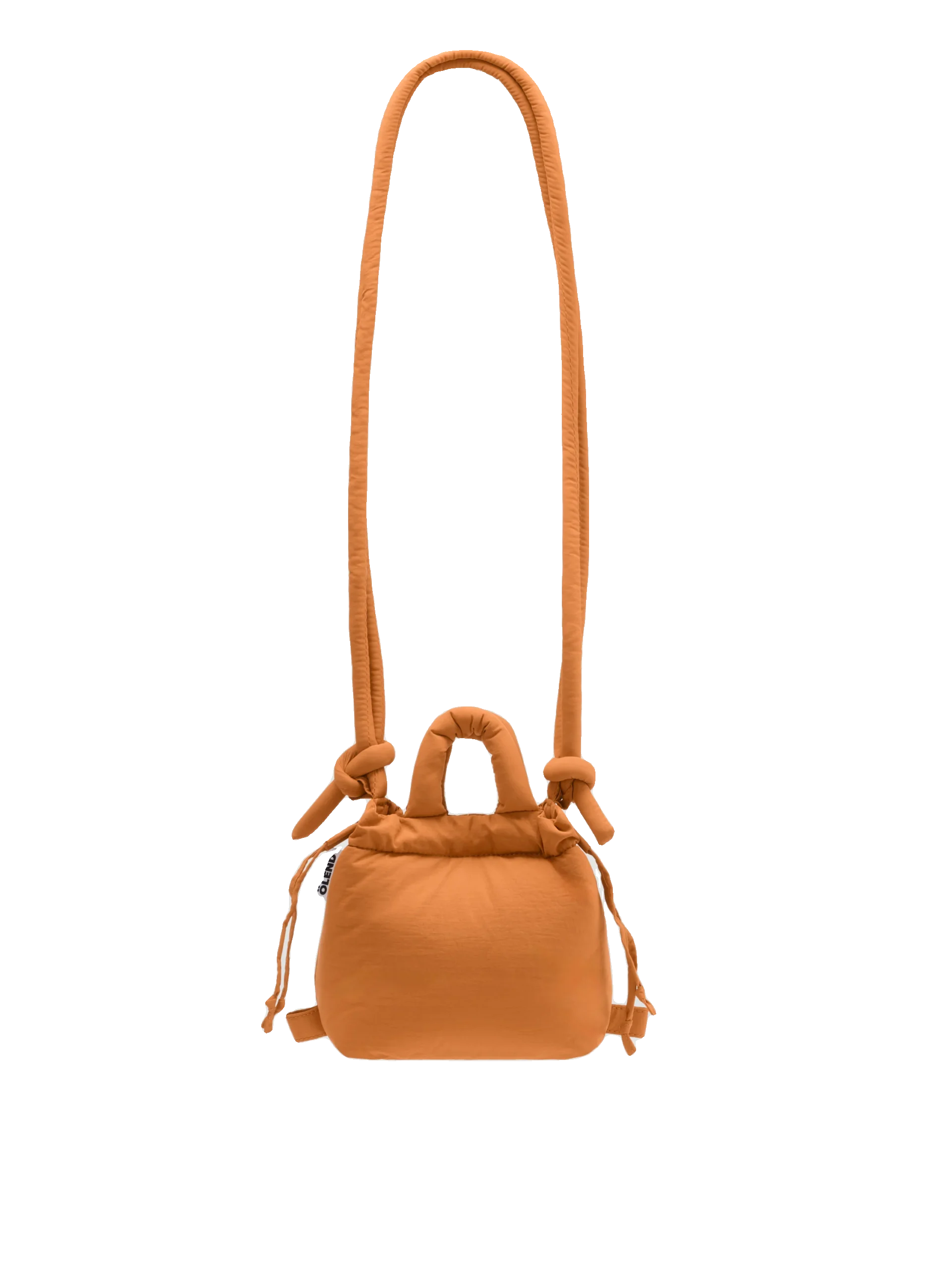 The Micro Ona Soft Bag - Oxide is a compact orange rectangular crossbody with a long strap, side drawstrings, and knot details—an eye-catching example of Estonian design, perfect for gifting and shown on a white background. Gate21.ee