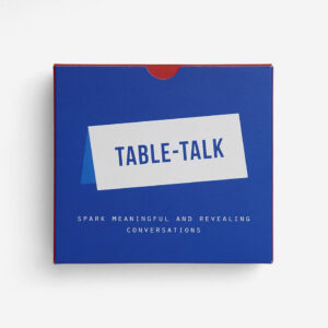 A blue box labelled "Table Talk Cards" in white and blue text, with "Spark meaningful and revealing conversations" below the main label, perfect for concept shops or Tallinn shoppers. Set against a plain white background. Gate21.ee