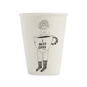 The Coffee Now cup is a white mug with a black line drawing of a person holding an oversized coffee cup labelled "I NEED COFFEE (now)", complete with steam and striped socks—a quirky, Tallinn-inspired Estonian design. Gate21.ee