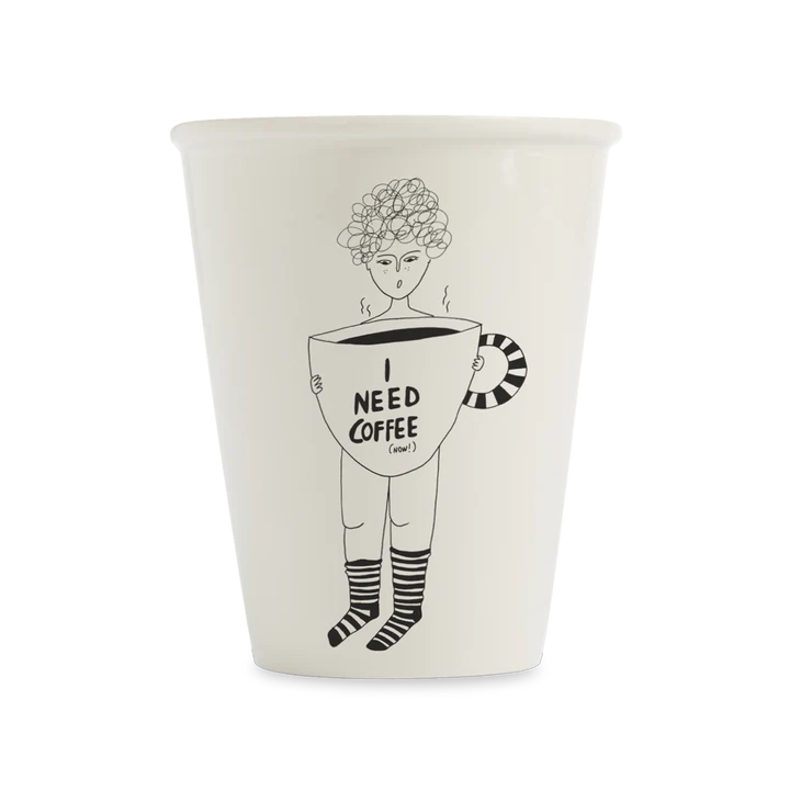 The Coffee Now cup is a white mug with a black line drawing of a person holding an oversized coffee cup labelled "I NEED COFFEE (now)", complete with steam and striped socks—a quirky, Tallinn-inspired Estonian design. Gate21.ee