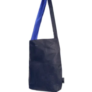 The Feel Good Bag - Midnight Blue is a stylish rectangular tote with a subtle sheen, long two-tone strap, blue inner side, and a small tag near the bottom seam—perfect for any Tallinn shopping adventure or local concept shop. Gate21.ee