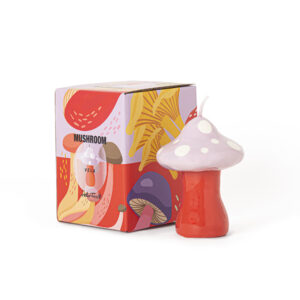 A white mushroom-shaped candle sits beside a vibrant illustrated box labelled "mushroom" with abstract designs—a curated find perfect for any gift shop. The Mushroom Candle - White and its box are displayed on a white background. Gate21.ee