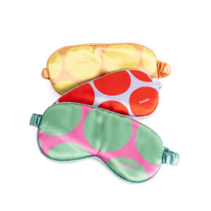 The Eye Mask - Golden Dot, featuring bold yellow and orange polka dots and curated Estonian design, is displayed on a white background—a perfect gift shop find. Gate21.ee