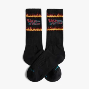 A pair of black crew socks from the Back to the Future - Athletic line feature the iconic logo above a flame, plus LION and JAW in blue on the toes—an ideal gift shop pick for anyone after unique Back to the Future items. Gate21.ee