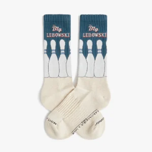 A pair of athletic socks in cream and blue featuring Back to the Future branding—perfect for fans or as a quirky gift from your favourite concept store. Text on the soles includes BACK TO THE FUTURE and STANCE X THE FUTURE. Gate21.ee