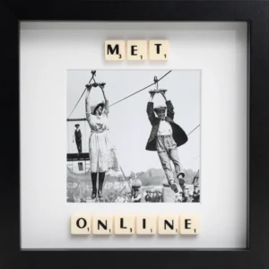 The MET ONLINE - Scrabble Print features a black-and-white photo of a woman and man on a zipwire, framed by Scrabble tiles spelling "MET ONLINE"—a perfect way to celebrate a memorable moment. Gate21.ee