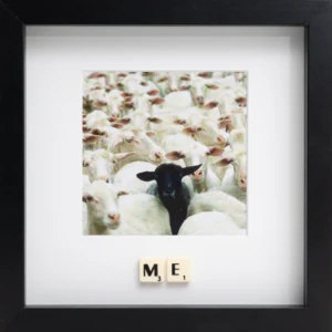 A photo features a black sheep among white sheep; below, Scrabble tiles spell "ME" in a black frame. This ME - Scrabble Print evokes memories and moments that matter. Gate21.ee