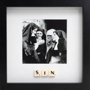 The SIN - Scrabble Print features a black-and-white photo of four women dressed as nuns, smoking together. "SIN" is spelt out in Scrabble tiles below the image—all in a black frame, perfect for sparking memories or conversation. Gate21.ee