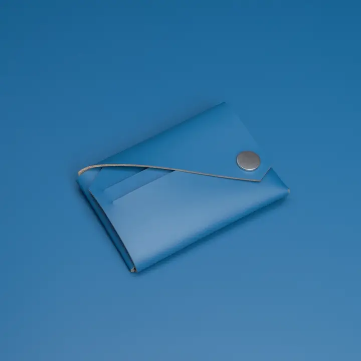 A closed LEMUR - Blue Wallet with an envelope style, button fastening, and thin strap is placed on a matching blue surface. Gate21.ee