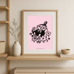 The Moomin Poster - Troll Temper features a black line drawing of a cartoon character among flowers on a pink background, displayed framed on a wooden shelf with a vase, bowl, and book nearby. Gate21.ee