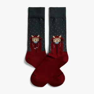 The Raining Cat - Grey socks by Jimmy Lion feature a cat in a red hoodie holding a cup, set against raindrop patterns on dark grey, with solid red toe and heel accents. Gate21.ee