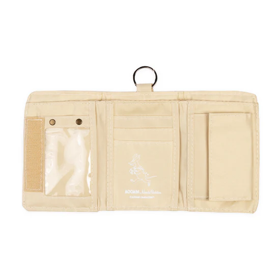 The Moomin Wallet - Snorkmaiden Reading is a beige trifold wallet with a transparent popper pocket on the left, central card slots featuring a white print, and a right flap pocket. A top metal ring lets you attach your favourite Moomin keyrings. Gate21.ee