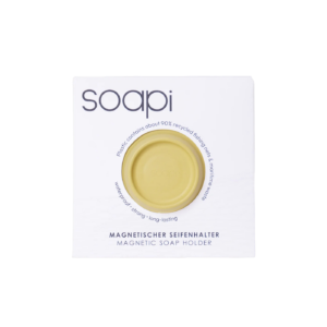 The Soapi - Yellow round magnetic soap holder comes in white recyclable packaging labelled "soapi" with dark purple text, made from ~90% recycled fishing nets. Gate21.ee