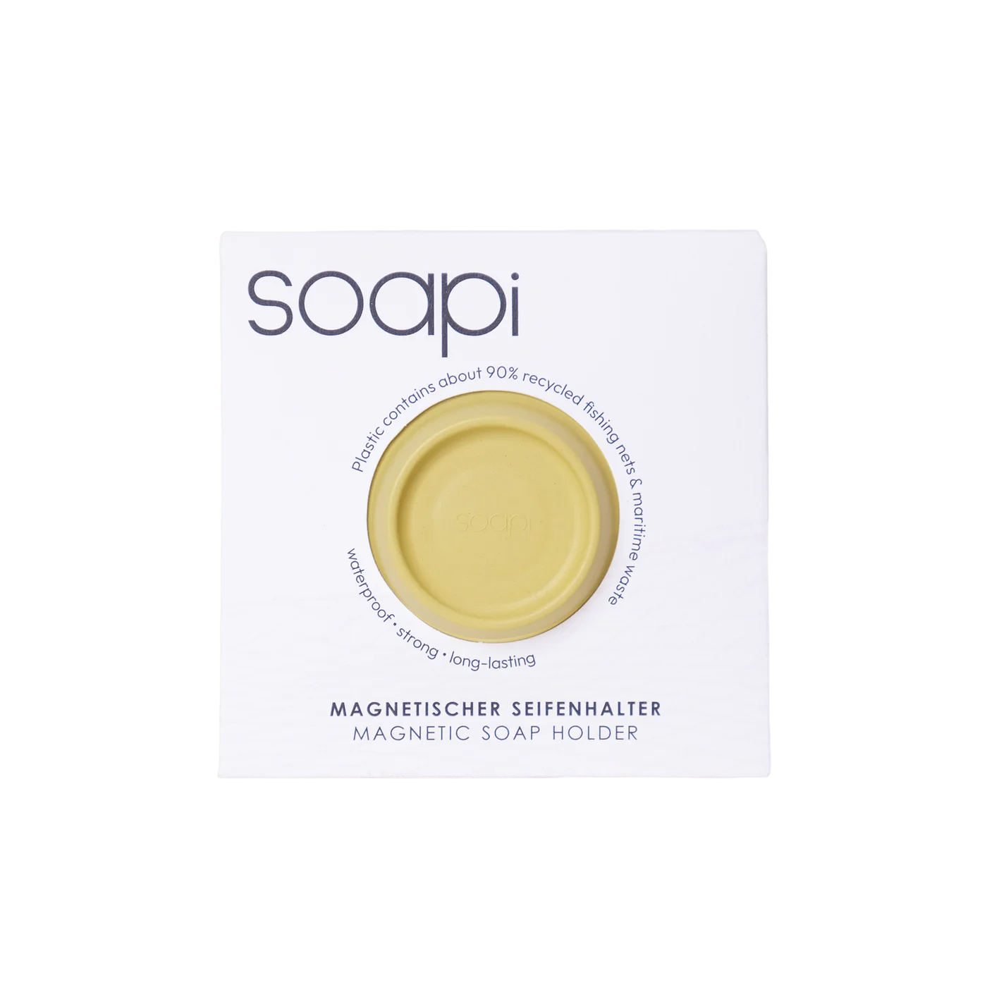 The Soapi - Yellow round magnetic soap holder comes in white recyclable packaging labelled "soapi" with dark purple text, made from ~90% recycled fishing nets. Gate21.ee