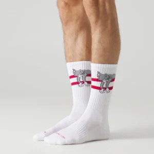 Someone wearing the Tom and Jerry Original - Athletic socks—white crew socks with red stripes and a Tom graphic—stands against a plain light background. Gate21.ee