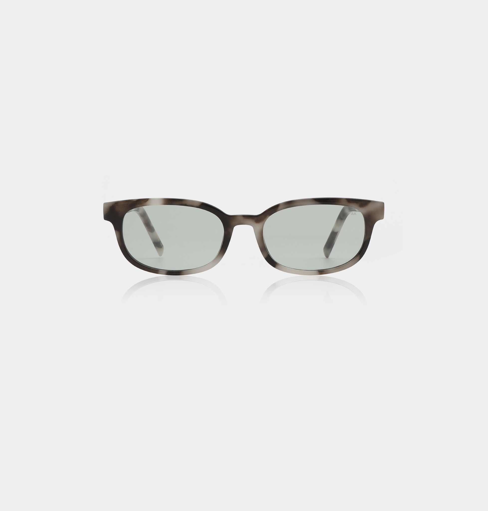A pair of square-shaped spectacles, model Charlie - Cookie Dough, with thick, translucent grey and black frames in an A. Kjærbede style, displayed facing forward on a plain white background. Gate21.ee