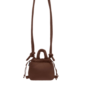 The Micro Ona Soft Bag - Chocolate is a small brown bag with a puffy texture, two knotted handles, an adjustable long strap, and side drawstring fastening, shown against a plain white background. Gate21.ee