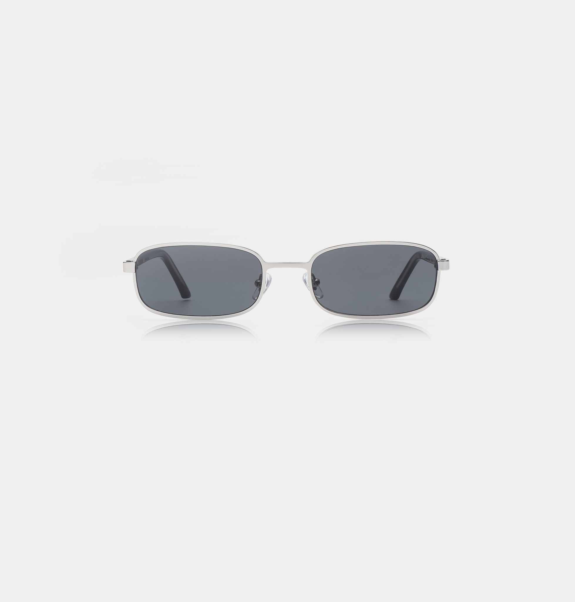 The Noah - Silver Black sunglasses, featuring rectangular dark lenses and thin silver metal frames, are centred on a plain white background. Gate21.ee