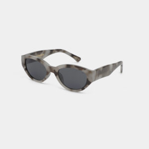 A pair of Winnie - Cookie Dough sunglasses with oval black lenses and thick, marbled grey and white frames, displayed on a white background. Gate21.ee