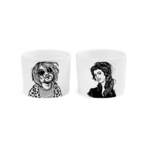 The Rockers Espresso set includes two white ceramic cups, each with a black line drawing: one depicts a person with long hair and sunglasses, the other shows a person with their long hair styled up. Gate21.ee