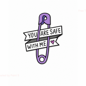 The Safe with Me - Pin features a drawing of a purple safety pin with two white banners reading "You are safe with me" in black letters and includes a small purple heart beside the text. Gate21.ee