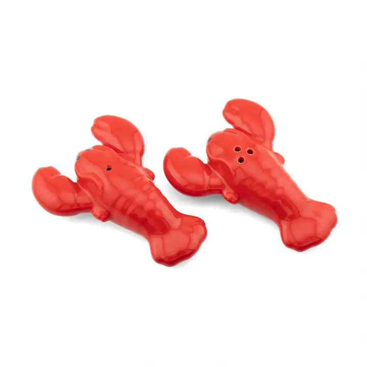 The Lobster - Salt & Pepper Shakers set features two red ceramic shakers shaped like lobsters, each with holes on its back for easy seasoning. Displayed on a white background. Gate21.ee