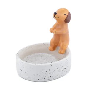 A small, round, speckled white ceramic Sausage Dog - Tealight holder featuring a smiling brown dog figurine on its rim with raised front paws. Gate21.ee