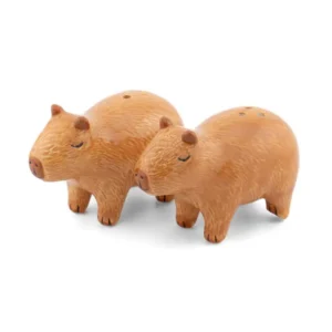 Capibara - Salt & Pepper Shakers: A pair of ceramic capybara-shaped shakers with small holes on top, displayed side by side against a plain white background. Gate21.ee
