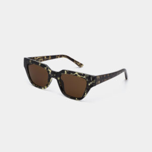 A pair of KAWS - Black/Yellow Tortoise square-shaped sunglasses featuring dark brown lenses and a black and yellow tortoiseshell-patterned frame, displayed on a white background. Gate21.ee