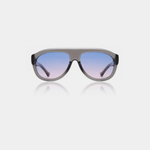 The Rio - Grey transparent sunglasses by A. Kjærbede feature a thick, translucent grey frame and large gradient lenses fading from blue to pink, shown against a white background. Gate21.ee