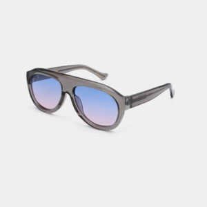 A pair of A. Kjærbede Rio - Grey transparent sunglasses with thick frames and gradient blue-to-pink lenses, shown on a white background. Gate21.ee