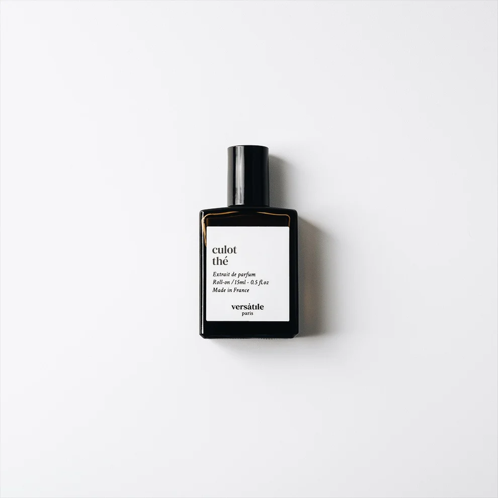 A black rectangular perfume bottle with a white label reading culot thé and versatile paris is centred on a plain white background, showcasing Culot Thé roll-on EDP—a unique unisex scent for any occasion. Gate21.ee