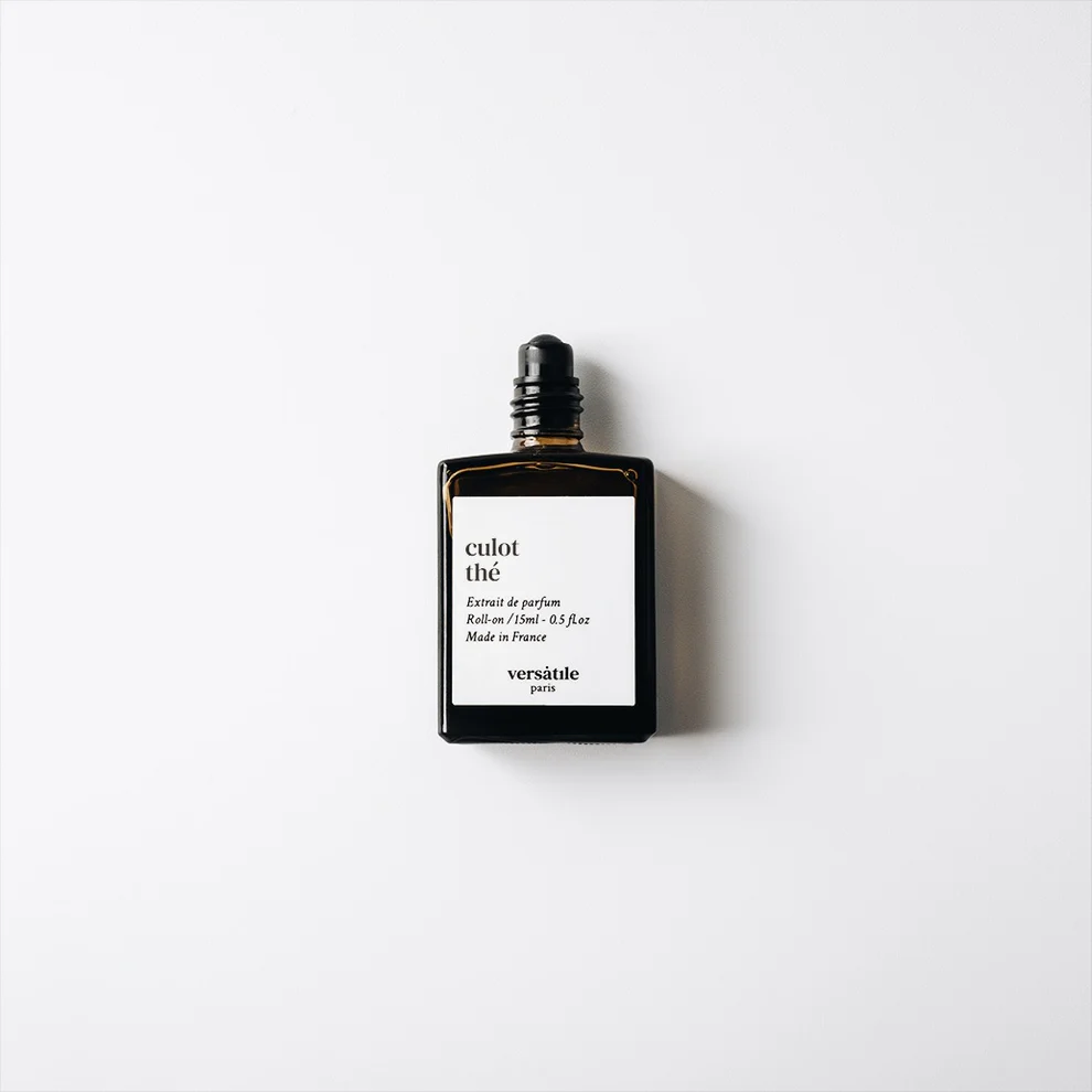 A dark glass perfume bottle with a black cap labelled “Culot The roll-on EDP” sits on a white background. This unique unisex fragrance by Versatile Paris comes in a 30ml size, reminiscent of YMC Bon Parfumeur. Product info appears in smaller text. Gate21.ee
