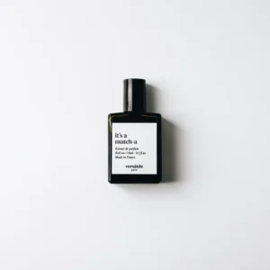 A black bottle labelled "It&acute; a Match-a roll-on EDP" stands upright on a white surface, featuring "versatile paris" and other details, showcasing this unique unisex scent for those seeking something distinct. Gate21.ee