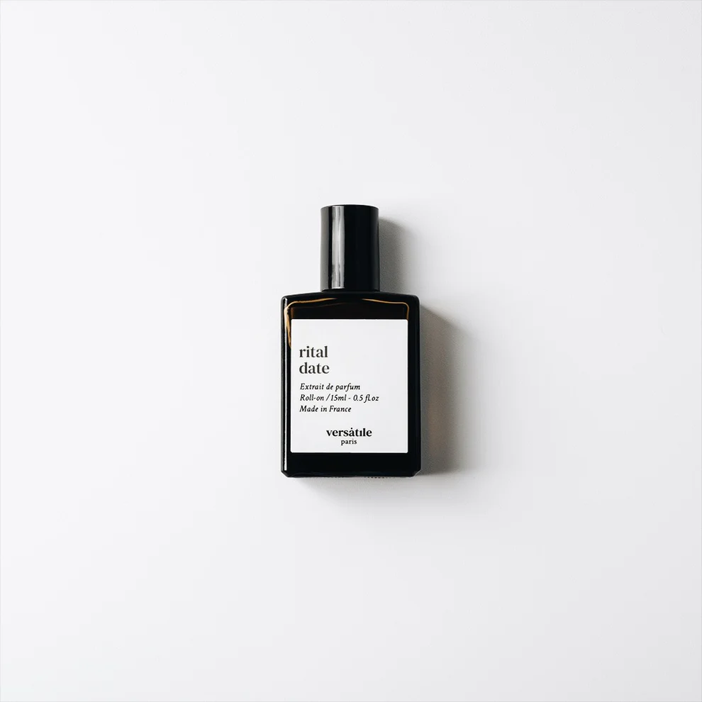 A black perfume bottle labelled "Rital Date roll-on EDP" by Versatile Paris is centred on a plain white background. This unique unisex fragrance, similar to YMC Bon Parfumeur 30ml, displays product and origin details in black text. Gate21.ee