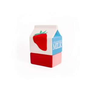 A ceramic jewellery box shaped like a milk carton, featuring a red strawberry illustration and the words &ldquo;Strawberry Milk&rdquo; on the side, sits on a solid red rectangular base against a white background&mdash;an adorable accent that would pair perfectly with the dreamy cat jewellery plate by Hello Ferretti. Product Name: Milk - Jewellery Box. Gate21.ee