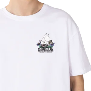 A person wears the Moomin Heavy Ts - Meadow T-shirt, which is white and showcases a small illustration of a Moomin character among flowers, with the text “MOOMIN BY NORDICBUDDIES NATURE IS AMAZING” underneath. Gate21.ee